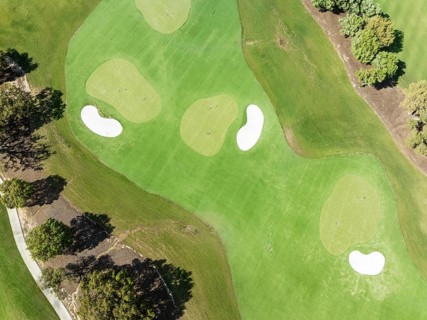 Driving range with greens and bunkers at the San Roque Club Golf Resort. Aerial view. Drone shot.