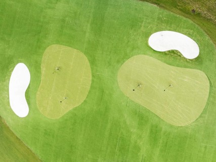 Driving range with greens and bunkers at the San Roque Club Golf Resort. Aerial view. Drone shot.