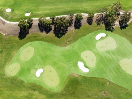 Driving range with greens and bunkers at the San Roque Club Golf Resort. Aerial view. Drone shot.