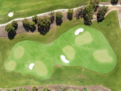 Driving range with greens and bunkers at the San Roque Club Golf Resort. Aerial view. Drone shot.