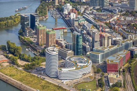 Aerial view, Media harbour on the river Rhine, construction site with construction crane and new