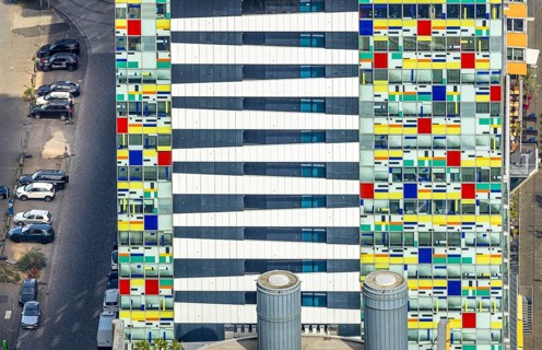Aerial view, Colorium Hotel Innside Düsseldorf harbour and artistic coloured glass panel facade,