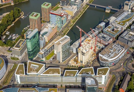 Aerial view, Media harbour on the river Rhine, construction site with construction crane and new