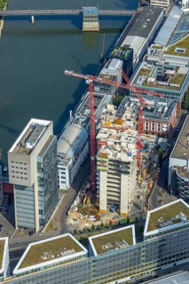 Aerial view, Media harbour on the river Rhine, construction site with construction crane and new
