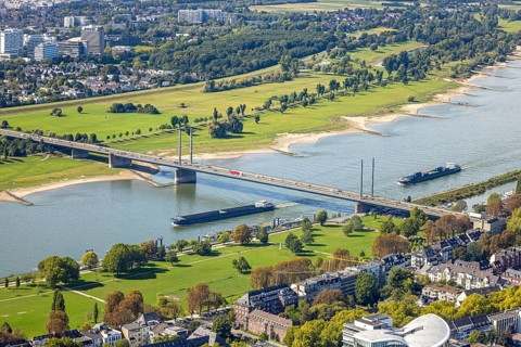 Aerial view, Theodor-Heuss-Bridge and inland navigation on the river Rhine, in front Rheinpark