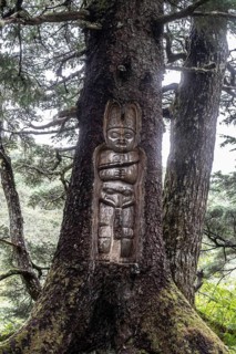 Totem pole carved into a tree, Juneau, Alaska, USA