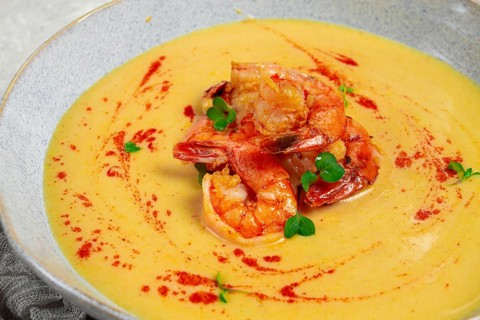 Pumpkin cream soup with shrimp, herbs and spices, homemade, no people
