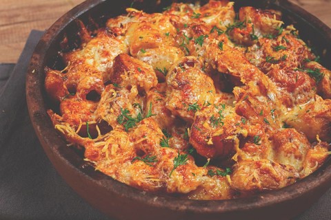 Baked fish with potatoes and cheese, gratin, homemade, no people