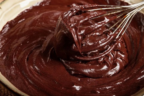 A bowl of chocolate dough, a whisk for whipping, baking, structure and consistency, homemade, top