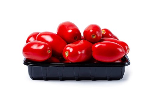 Plum-shaped tomatoes, fresh, in a black plastic container, on a white background, isolate