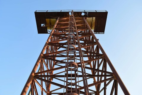 The old rusty water tower tilted. Atyrau, Kazakhstan