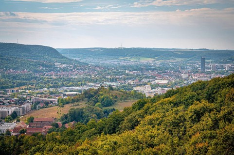 View of the city of Jena and mountains in the background from a wooded hill, Jena, Thuringia,