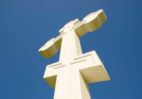 White orthodox christian cross on blue sky background. Krasnodar, Russia