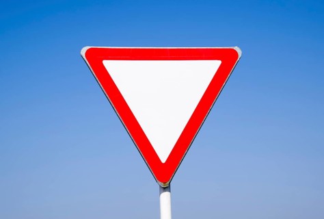 Road signs, give way. Sign on a blue background. Krasnodar, Russia