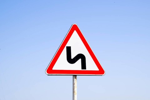 Road sign dangerous turn. Krasnodar, Russia