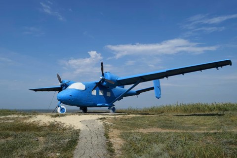 Blue rotary-wing aircraft on the hill. Taman, Krasnodar Krai, Russia