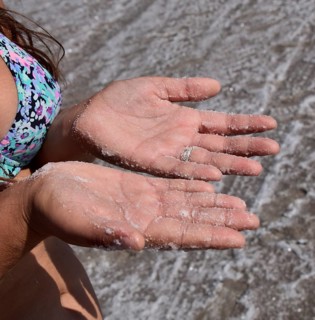 Salt on the girl's hands. Taman, Krasnodar Krai, Russia