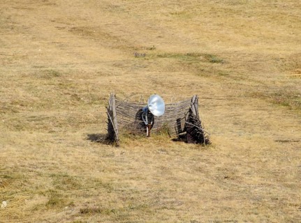 Lamp with a searchlight on the lawn for lighting a high object. Taman, Krasnodar Krai, Russia