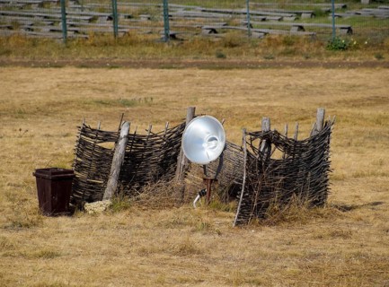 Lamp with a searchlight on the lawn for lighting a high object. Taman, Krasnodar Krai, Russia