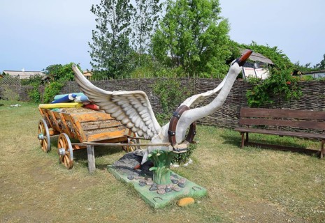 A statue of a swan harnessed to a cart. Taman, Krasnodar Krai, Russia