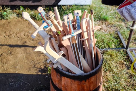 Wooden swords in a barrel. Taman, Krasnodar Krai, Russia