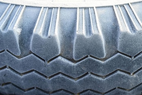 Hoarfrost on a rubber tire wheel. Krasnodar, Russia