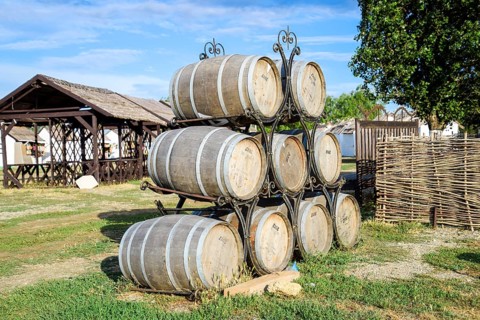 Stacked wine barrels. Decoration of the barrels in the village Ataman. Taman, Krasnodar Krai,