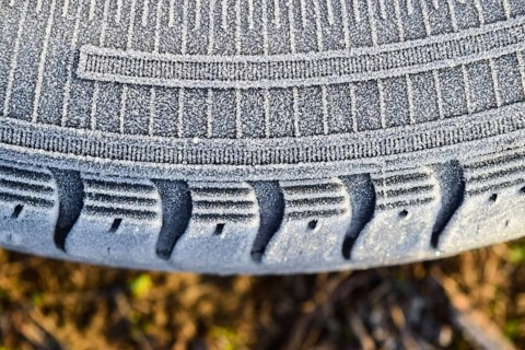 Hoarfrost on a rubber tire wheel. Krasnodar, Russia