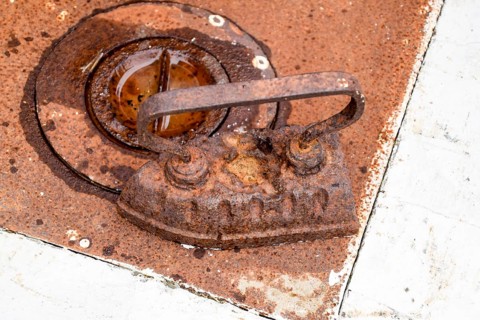 An ancient iron iron on the stove. Taman, Krasnodar Krai, Russia