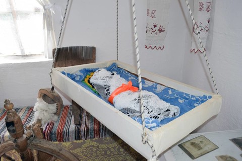 Cradle with dolls in the bedroom. Taman, Krasnodar Krai, Russia