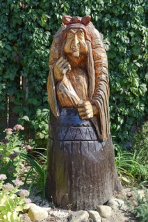 The wooden statue of Baba Yaga in a mortar. Taman, Krasnodar Krai, Russia