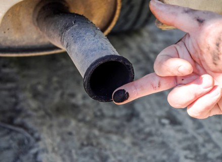 Soot from the exhaust pipe on the finger. Atyrau, Kazakhstan