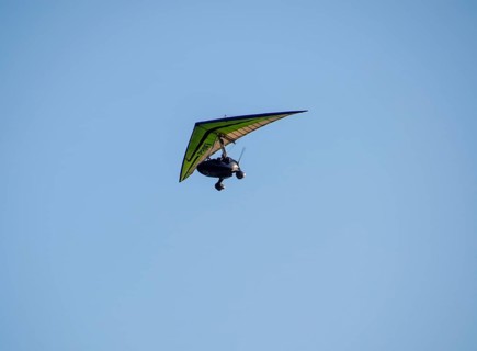 Trike, flying in the sky with two people. Extreme Entertainment travelers. Golubitskaya, Russia