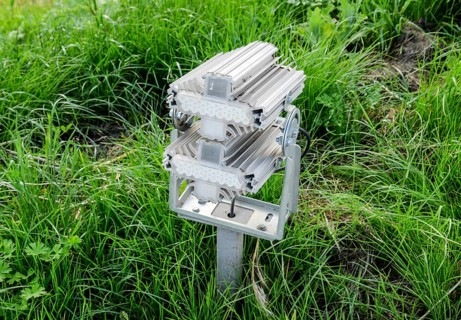 Streetlight illuminator is installed on the lawn. Atyrau, Kazakhstan