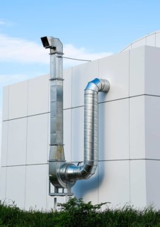 Ventilation hood with a pipe behind the cafe building. Atyrau, Kazakhstan