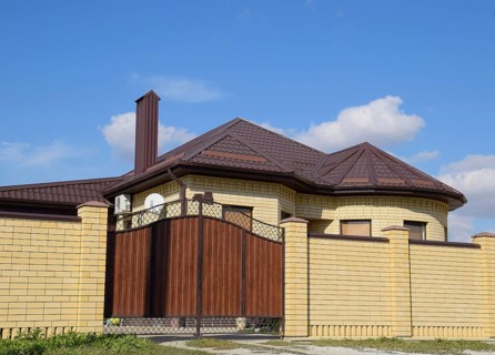 Decorative metal on the roof of a brick house. Atyrau, Kazakhstan