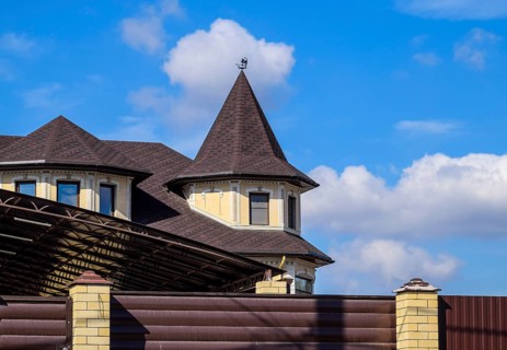 Decorative metal on the roof of a brick house. Atyrau, Kazakhstan