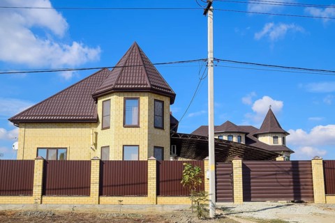 Decorative metal on the roof of a brick house. Atyrau, Kazakhstan