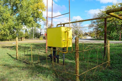 Yellow small gas distribution and regulating natural gas supply station. Atyrau, Kazakhstan