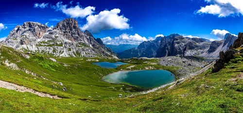 Alpine Landscape With Mountain Peaks And Clear Lakes At The Formation Tre Cime Di Lavaredo In The