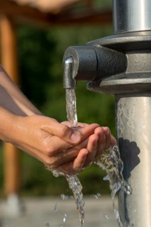 Catching Fresh And Cool Water And Cleaning Hands In An Artificial Spring, Austria