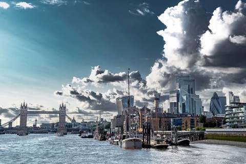 Tower Bridge And River Thames With Ships And Boats In Front Of Modern Office Buildings In The City