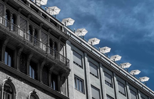 Roof Terrace With Sun Parasols On Historic And Modern Buildings In The Inner City Of Vienna In
