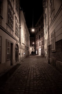 Narrow Alley With Streetlights And Cobblestones In The Inner City Of Vienna In Austria