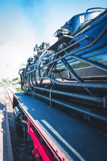 Detailed view of a black steam locomotive with focus on its mechanical parts and texture, Gera,