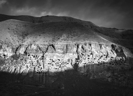 Black and white dramatic landscape of Vardzia, cave city. Georgia. Unique and mysterious places in