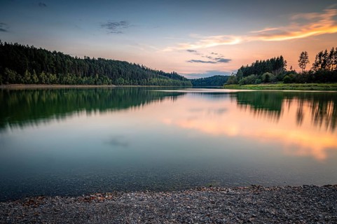 Calm reservoir with evening reflection of the forest and gentle light mood, Zeulenrodaer Meer