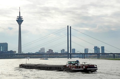 Inland navigation in front of the Rheinkniebrücke, behind it the Rheinturm, TV tower, Düsseldorf,