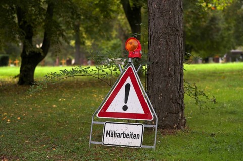 Sign, warning sign, mowing work, main cemetery, Stuttgart, Baden-Württemberg, Germany