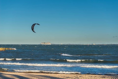 Kitesurfing in the Bay of Kiel in strong winds, high swell, Strande near Kiel,